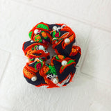 Di0143 Navratri Hand-Embroidered Black and Orange Silk Hair Bun with Pearl Accents