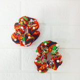 Di0143 Navratri Hand-Embroidered Black and Orange Silk Hair Bun with Pearl Accents