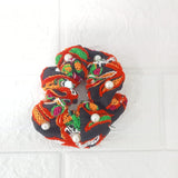 Di0143 Navratri Hand-Embroidered Black and Orange Silk Hair Bun with Pearl Accents