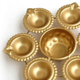 Di0320 Golden Decorative Diya Set – 6 Small Diyas with Central Holder